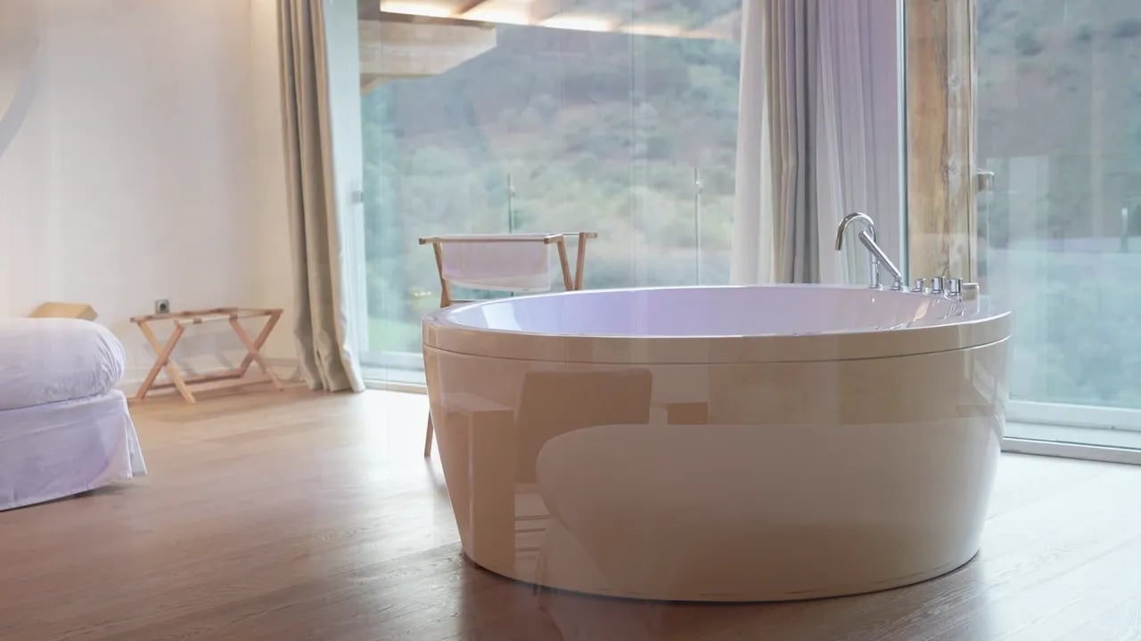 Room with a bathtub and views over the valley at Arantza Hotela, in Navarre