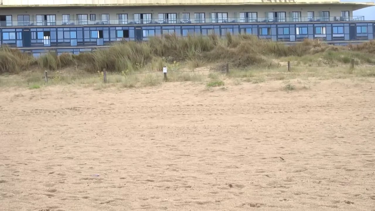 Hotel Juan de la Cosa seen from the beach, in Cantabria